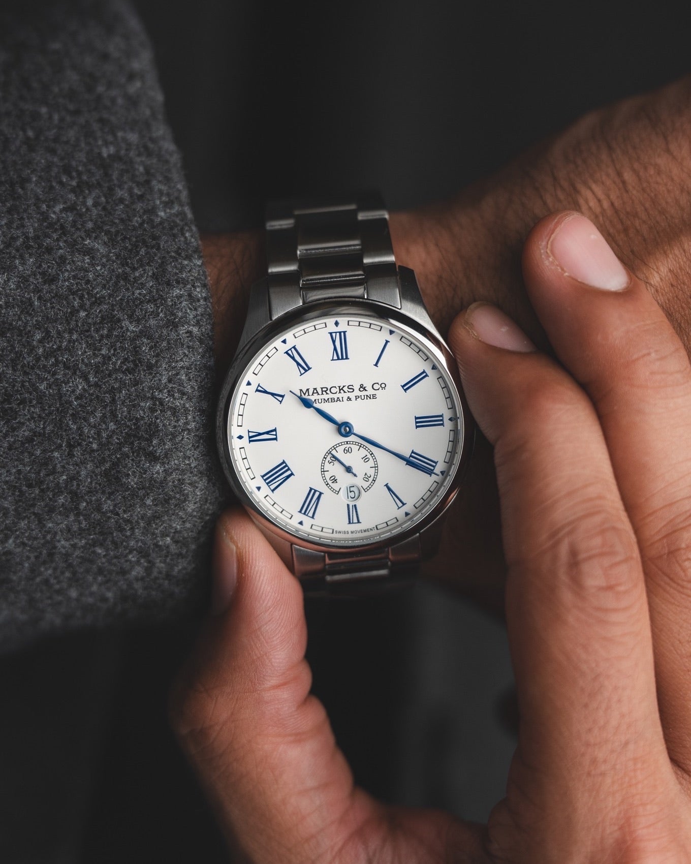 The Captain worn on a stainless-steel bracelet
