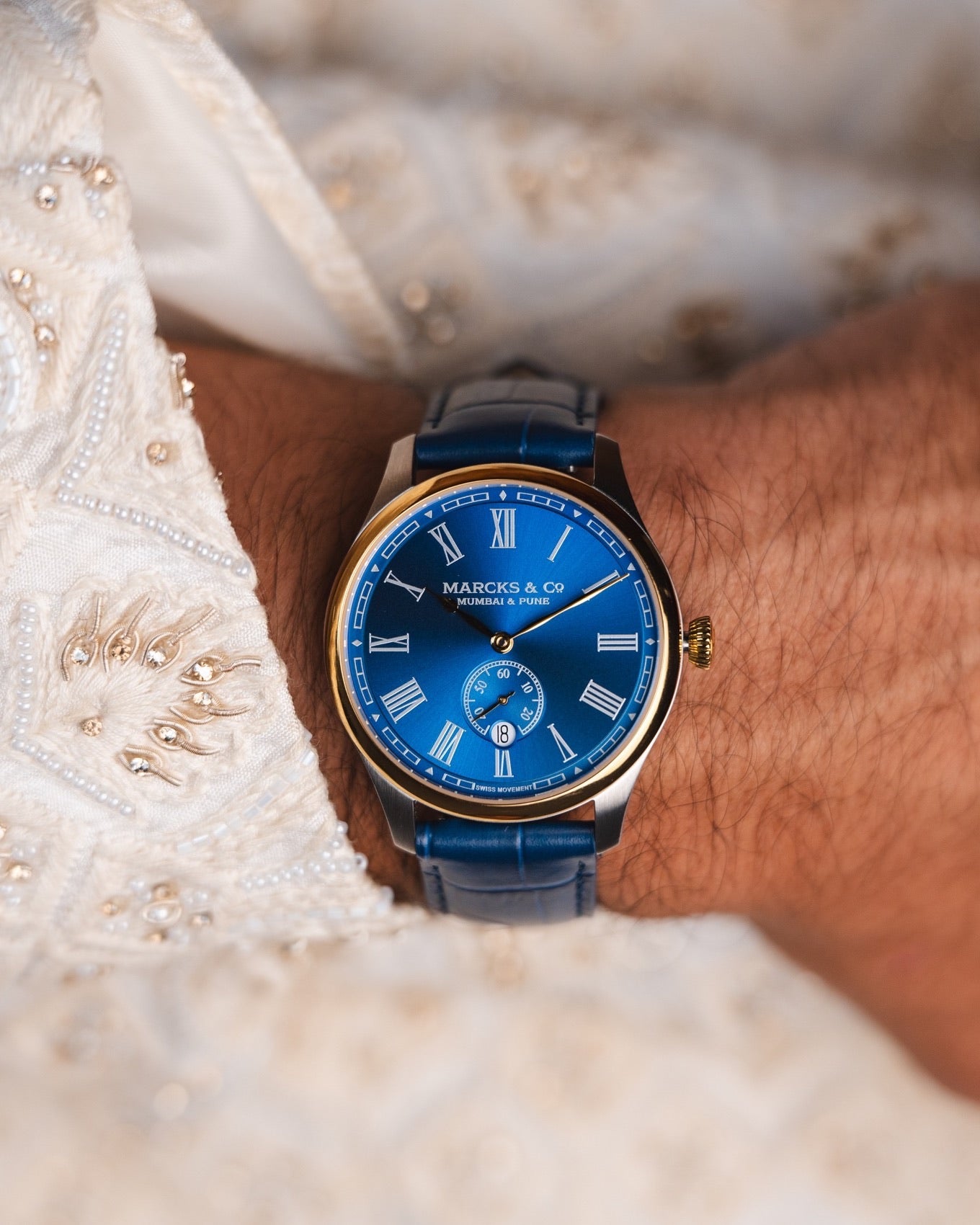 The Raja worn with a navy-blue leather strap